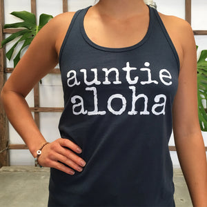 woman wearing a blue auntie aloha racer back tank top with hand on hip