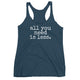 women's tank top with white font that says all you need is less
