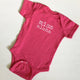 pink baby girl onesie with white lettering that says miss aloha
