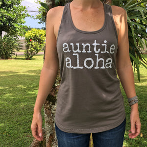woman in a garden wearing a gey auntie aloha racer back tank top