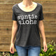 woman wearing a dark grey auntie aloha scoop neck tshirt with choker necklace