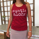 woman wearing a red auntie aloha racer back tank top with pink skirt
